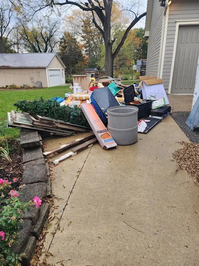 Dumpster being loaded with debris for 30 Yard Dumpster Rental in Lakeview Estates